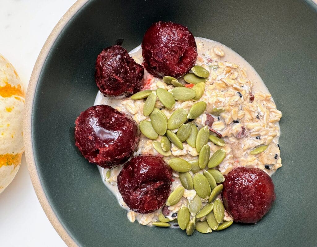 Bowl of overnight oats topped with pumpkin seeds demonstrating easy breakfast nutrition integration